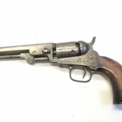 A rare 19th century Colt revolver the octagonal barrel stamped Address Col Colt London the barrel engraved with figures and horse drawn carriage stamped Colts Patent the side plate also stamped Colts Patent.