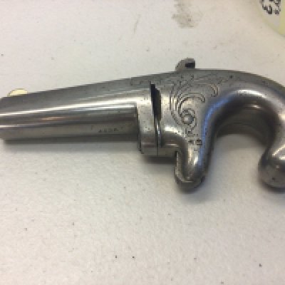 An Antique 19th century Colt No 1 Deringer rimfire pistol circa 1875 produced in relatively low numbers approximately 6500 the pistol with makers marks Colts Hartford CT USA serial number 4436.