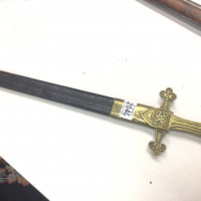 A British Military short sword 1856 pattern Mk 1 with Victorian Royal cypher. On the solid brass handle the steel blade with marks with a leather scabbard.