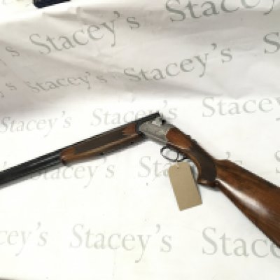 A 12 gauge over under shotgun by Lanber. Single trigger multi choke. 27.5 barrel length and 44.5 inches overall. Serial number 286011 -12 - 70 PLEASE NOTE THAT A SHOTGUN LICENSE IS REQUIRED TO PURCHASE THIS ITEM. COLLECTION AND VIEWING BY APPOINTMENT ONLY.