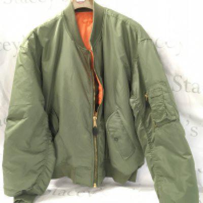 An American Military type Delta Star light green jacket with orange lining.
