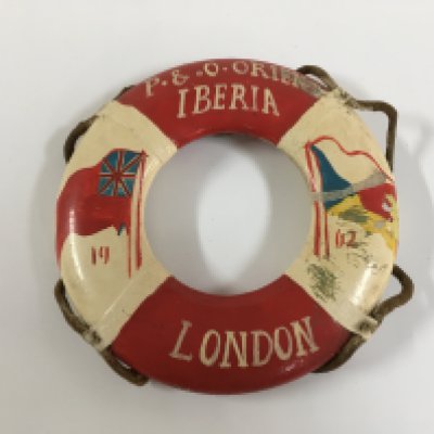 A collection of P & O Line items consisting of very early silver plated salt/mustard pot from the P&O Line, two sectioned silver plated serving dish from the P&O Line, souvenir tankard from the P&O vessel the SS Chusan, souvenir model life belt from the P&O/orient line vessel the SS Iberia, souvenir matches from the vessel SS Canberra and two handled dinner bowl from the P&O vessel the Canberra