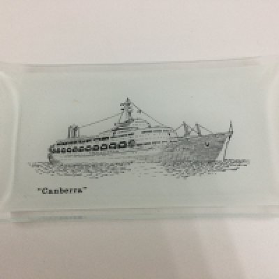 A collection of maritime glass items consisting of early Fred Olsen line shipping company souvenir glass paperweight from the 1970s, glass ashtray from the Mac Andrew line shipping company, superb champagne glass souvenir celebrating the 25th anniversary of the cruise line princess cruises, souvenir glass dish from the P&O vessel the Canberra, glass paperweight souvenir from the vessel the SS Dartington and a rare to find original glass ashtray from the Harrison line shipping company