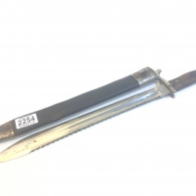 A First World War German Imperial sawback butcher bayonet S98. With maker mark with wood grip and leather scabbard.