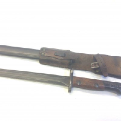 An intresting II world war period bayonet possible Portuguese stamped SA30 with crown serial number 62179 with steel scabbed. With leather frog attached.