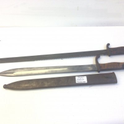 A German Imperial unusual saw bayonet no scabbard and a standard German butchers bayonet with steel scabbard. (2)