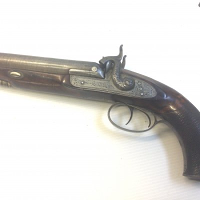 A Nice Example of an early 19th century double barrel muzzle load percussion pistol maker Smith London. The hammers and action with scroll engraving with a walnut stock length 30cm action functional.