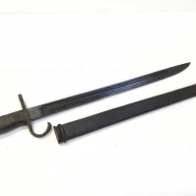 A Japanese II world war Arisaka bayonet with marks to the steel blade.
