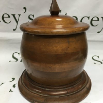 A large biscuit or tobacco jar made from a WWI era propeller.