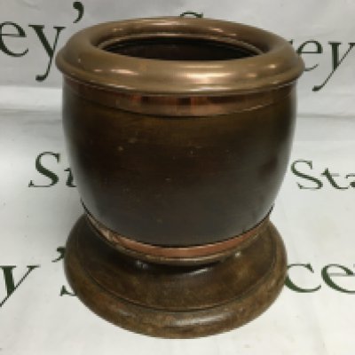A large ice bucket made from WWI era propeller boss with hand made copper insert with additional copper banding.