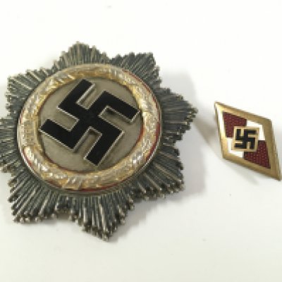 A Third Reich German cross and a Hitler youth honour badge . Postage category A
