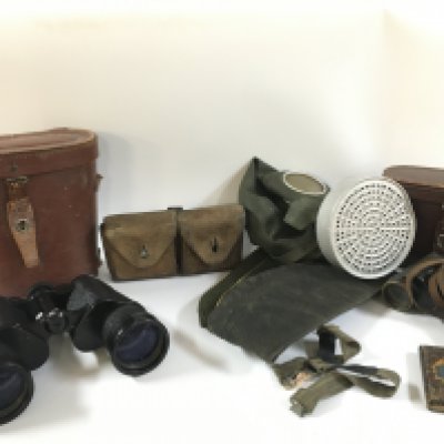 A collection of various military items including a gas mask, binoculars , leather ammo pouch, side caps etc. this lot cannot be posted