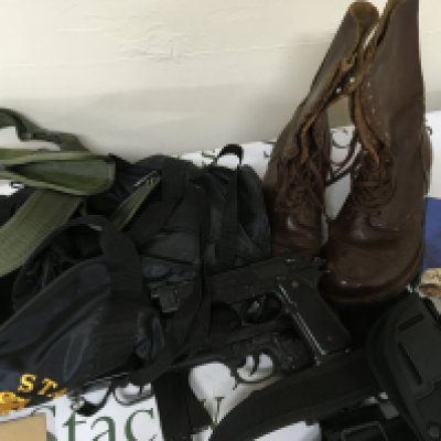 A pair of Military issue boots most likely American made by Beebe Bros Three replica non firing guns. Including Bruni MOD .92 Italian replica and Beretta replica. A USA Navy canvas bag and other webbing.