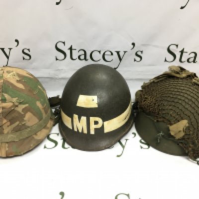 A Military Police helmet and two other 20th Century helmets (3). Shipping category C.