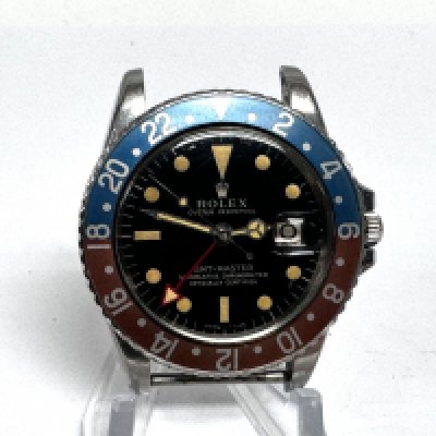 A 1966 Rolex GMT Master Pepsi gents 1675 model watch. Steel case. 40mm case. Black dial with desirable gilt like markers. Serial 1318156. A steel oyster rivet bracelet marked 7206 80 end link. Seen running but not tested time keeping. Postage B