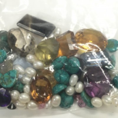 A collection of various gemstones. Postage category A