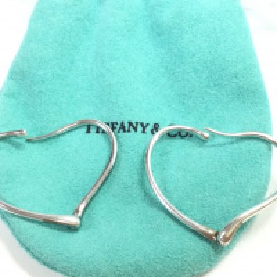 A pair of silver Tiffany and Co earrings. Postage category A