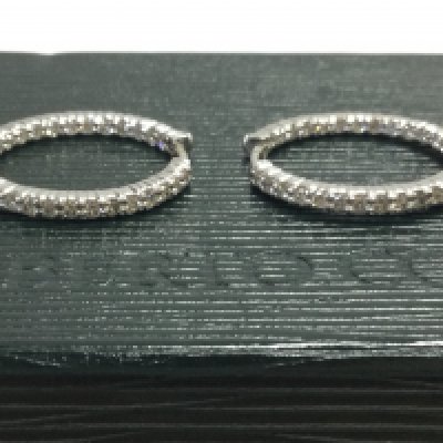 A pair of boxed Roberto Coin diamond inset 18ct white gold hoop earrings , 7.5g total weight. Postage category A