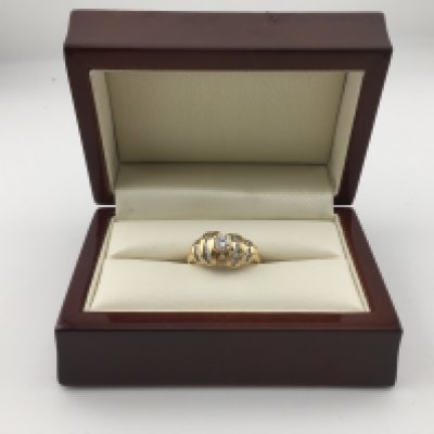 An 18ct diamond set cluster ring set with brilliant cut and baguette cut diamonds. Approx weight M Approx weight 6.7grams.