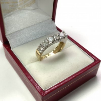 A 14ct yellow and white gold ring inset with CZ stones. Size N. (A)