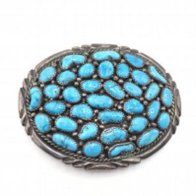 A vintage mens sterling silver and turquoise belt buckle. Approximately 8cm wide and 55.34g. Postage B