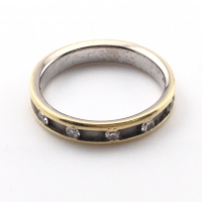 An 18k gold ring set with diamonds. Size P and 4.74g Postage A