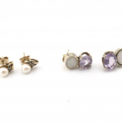 A pair of gold pearl set earrings and a pair of silver earrings set with opal and purple stone. Postage A