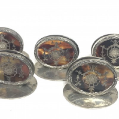 Five Silver Hallmarked and tortoiseshell menu holders. Postage category B