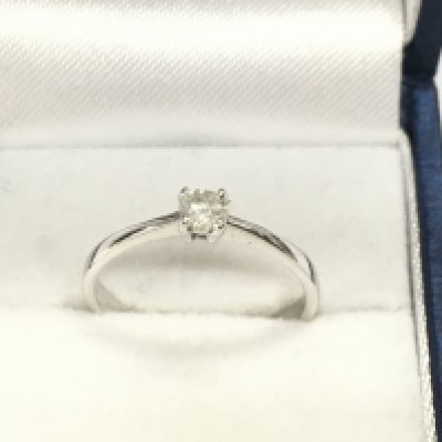A 14ct white gold diamond solitaire ring approximately 0.18ct and 1.96g size N Postage B