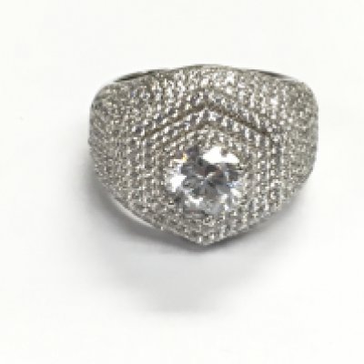 A large silver dinner ring set with several white cubic zirconia. Size U Postage A