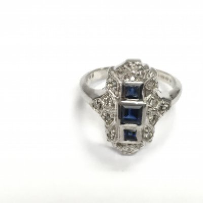 14ct white gold art deco style sapphire and diamond ring. Step cut sapphires approx 0.40ct and 0.18ct diamond. Size K Postage A