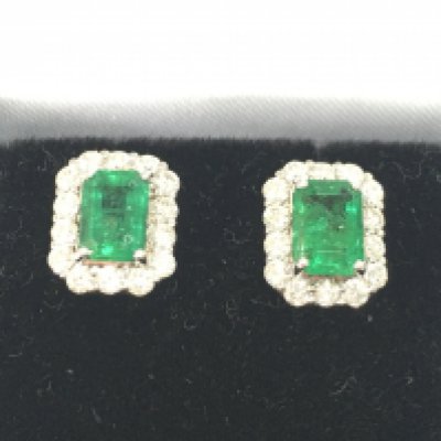 Pair of 18ct white gold rectangular chamfered cluster studs set with emeralds. Emeralds 1.32ct and 0.68ct diamonds approx.