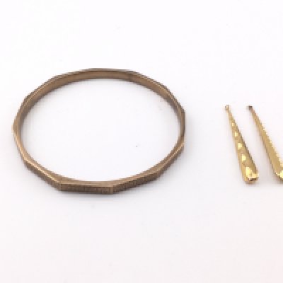 A 9ct gold bangle and a pair of earrings. Bangle is 8cm diameter. Total weight 25.20g Postage B