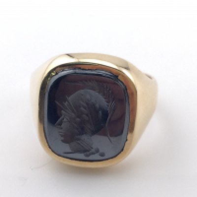 A 9k gold Hematite signet ring. Size R and 8.25g Postage A