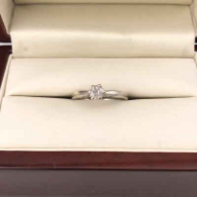 A 9ct white gold solitaire ring. Approx weight 2.24 grams, approx size M.