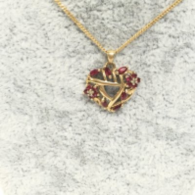 9ct gold ruby and diamond chip pendant on chain. Postage A