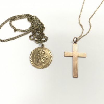 A 9ct gold cross on 9ct chain and a 9ct gold st Christopher with gold chain. 15.37g total. Postage B
