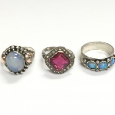 Three silver dress rings. Postage A