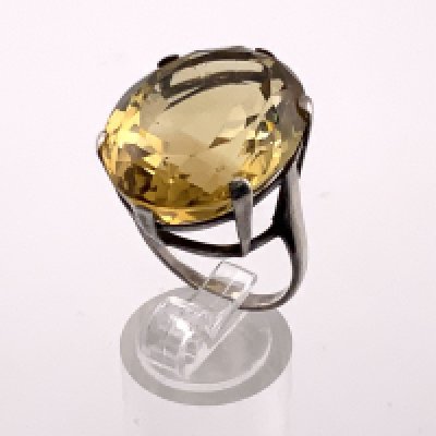 A large approximately 33ct oval cut citrine mounted in a sterling silver ring mount, Size P