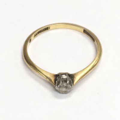 An 18ct gold diamond solitaire ring. Size O and 1.72g