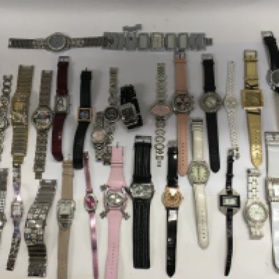 A large collection of assorted fashion watches. Postage B