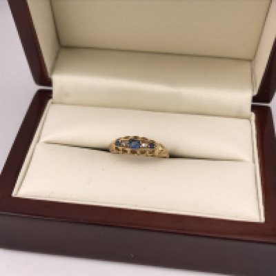An 18ct diamond and sapphire set ring, approx size N. Approx weight 2.45 grams.