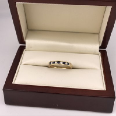 An 18ct gold diamond and sapphire half eternity ring. Approx size N, approx weigh 2.8 grams.