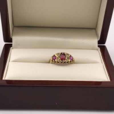 An 18ct diamond and Ruby set ring. Approx weight 2.70 grams, approx size J.