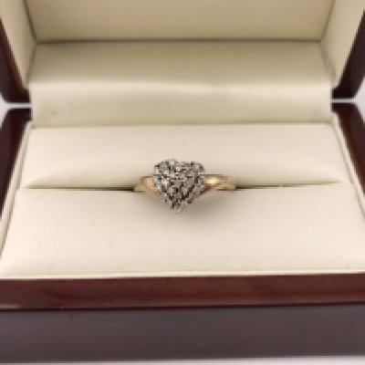 A 9ct diamond heart cluster ring. Approx weight 2.52 grams, approx size P.