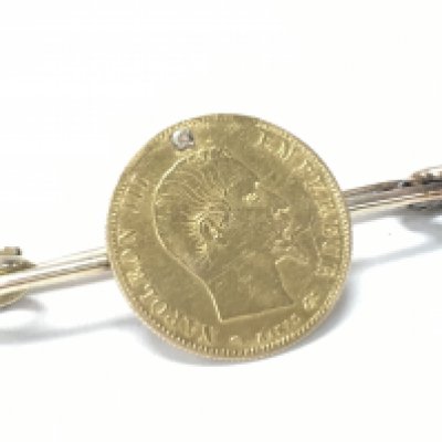 An 1889 J Franc gold coin. Postage category A