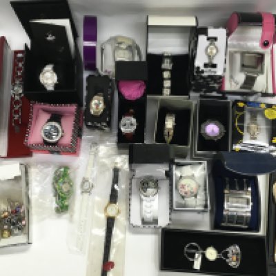 A large collection of assorted fashion watches many boxed including Disney. Postage B