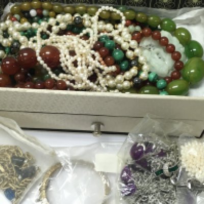 A box of beaded jewellery including necklaces and bracelets. Postage category B
