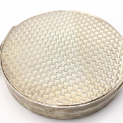 A Silver Asprey circular shaped silver gilt compact, London 1957