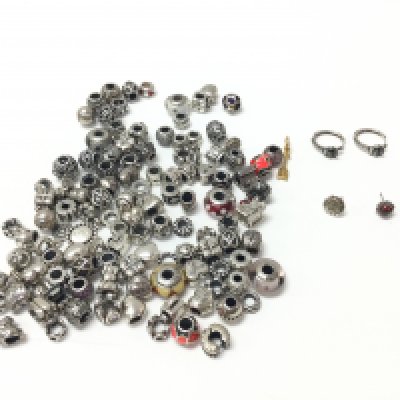 A collection of various Pandora charm and earrings. Postage B